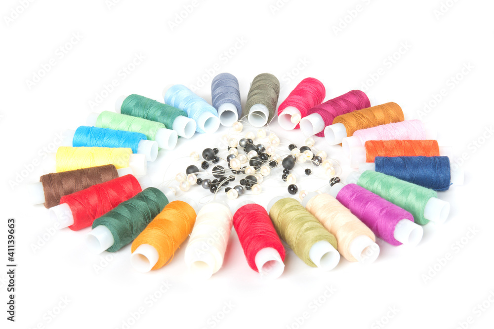 threads and beads on white background threads and beads on white background