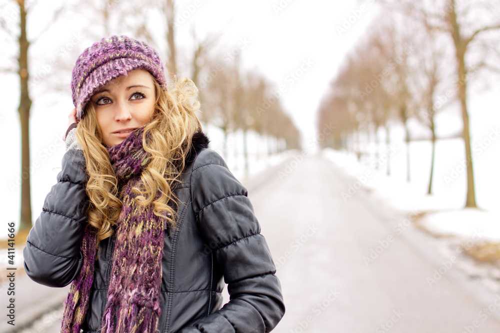 young woman outside in winter in snow cold young woman outside in winter in snow cold