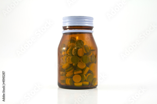 Medicine glass bottle with pills