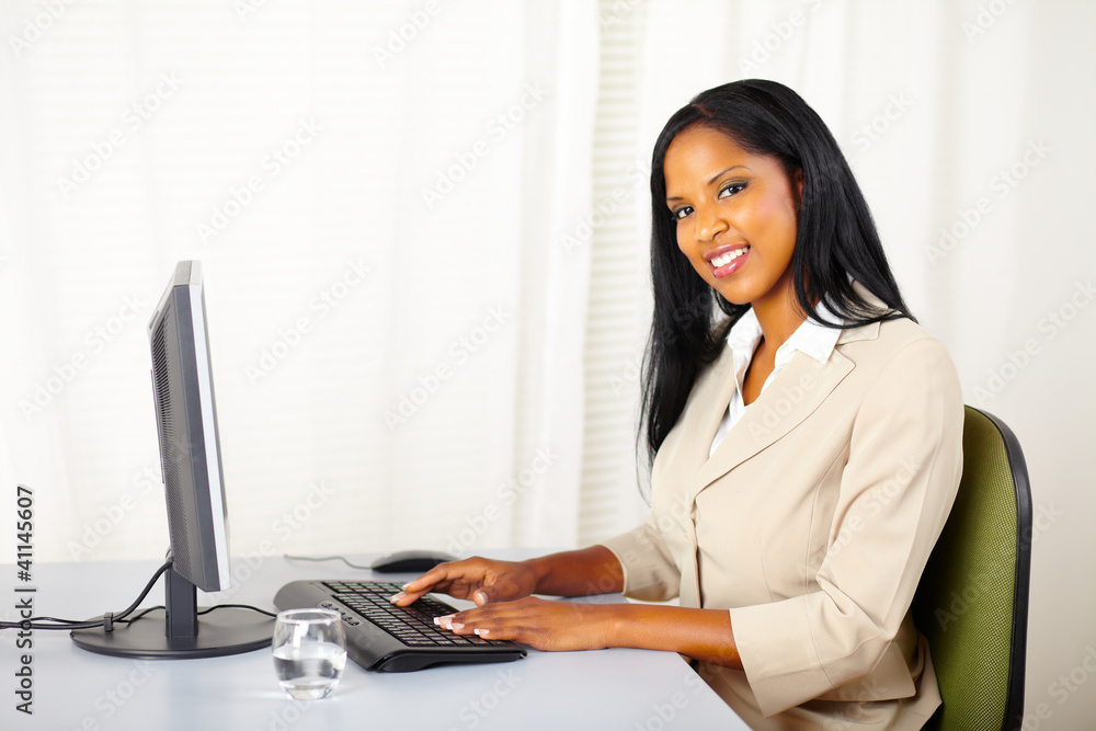 Beautiful businesswoman working on computer Beautiful businesswoman working on computer