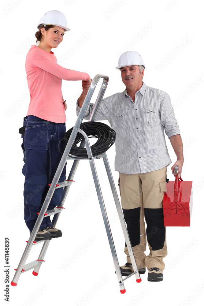 Electrician and apprentice on a ladder Electrician and apprentice on a ladder
