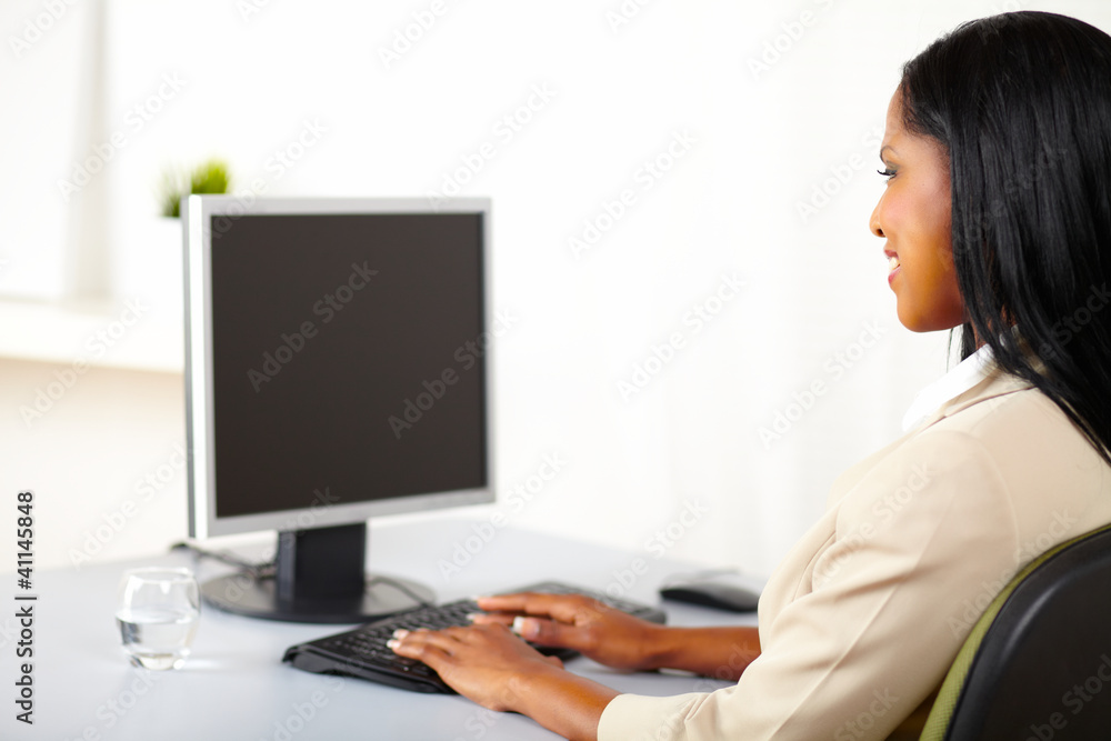 Professional woman looking to a monitor Professional woman looking to a monitor