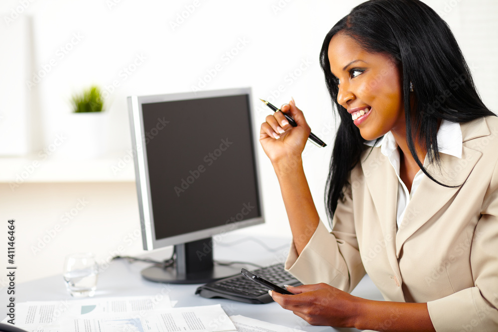 Executive female using a cellphone Executive female using a cellphone