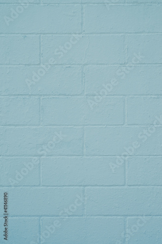 Brick wall painted with a blue paint