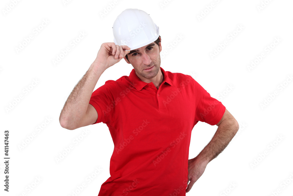 craftsman putting on his helmet