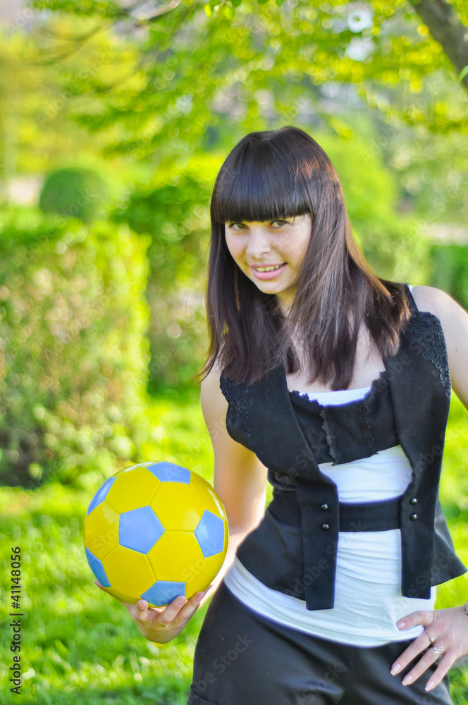 Beautiful Ukrainian girl with a ball in the colors of UKR flag Beautiful Ukrainian girl with a ball in the colors of UKR flag