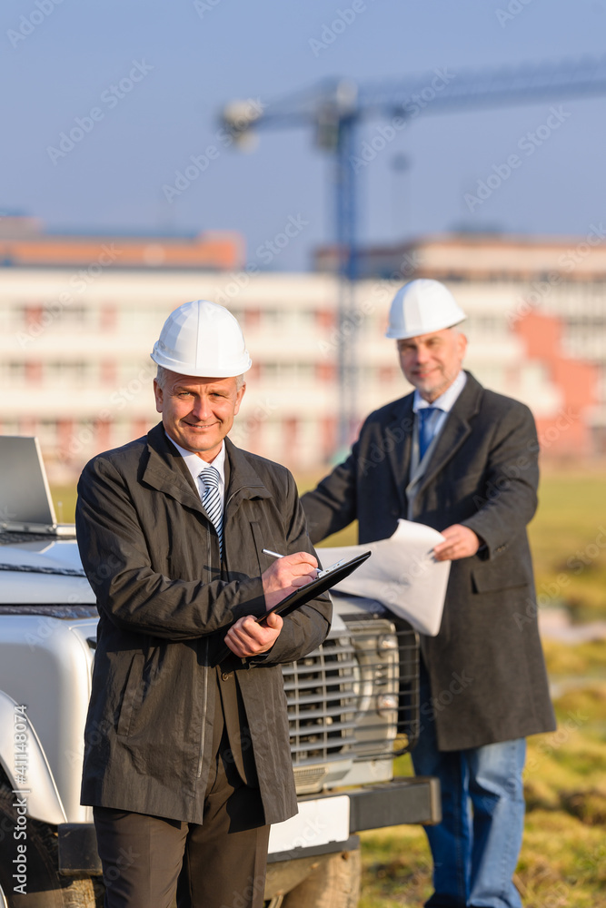 Architect man make notes on construction site Architect man make notes on construction site