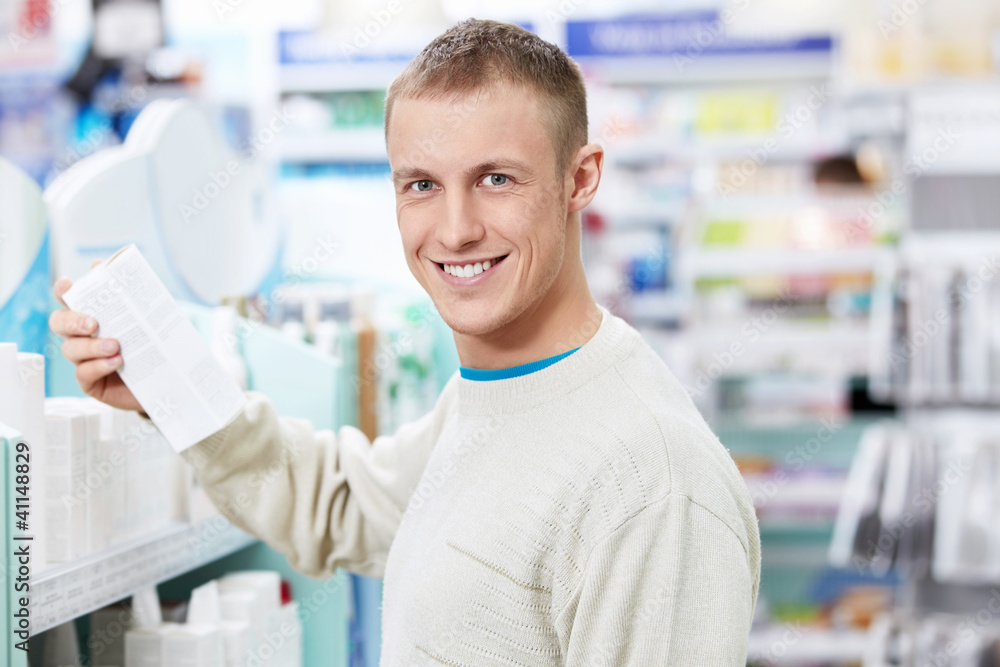 Fototapeta premium A young customer in the pharmacy
