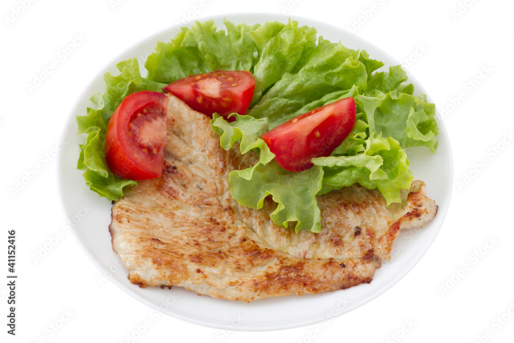 fried turkey with salad on the white plate