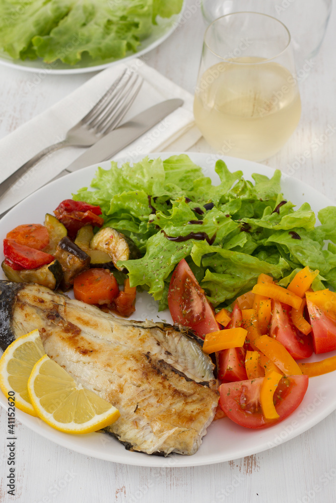 fried fish with vegetables and salad fried fish with vegetables and salad