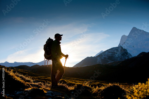 Hiker in Himalaya mountains photo