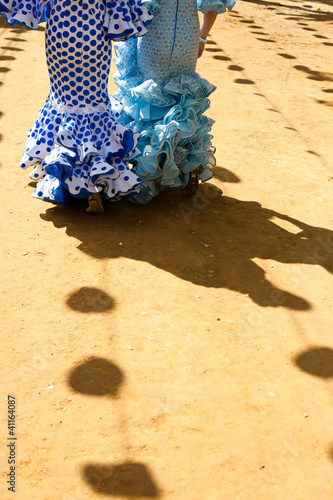 Women wearing flamenco dresses at Seville's fairground.