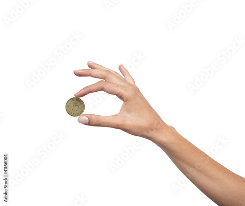Woman hand with coin isolated on white