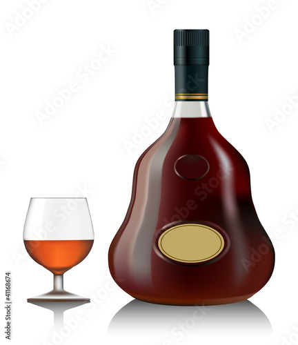 Snifter glass of cognac and bottle