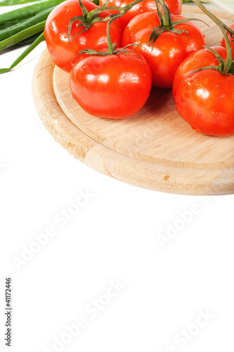 Fresh tomatoes on a branch