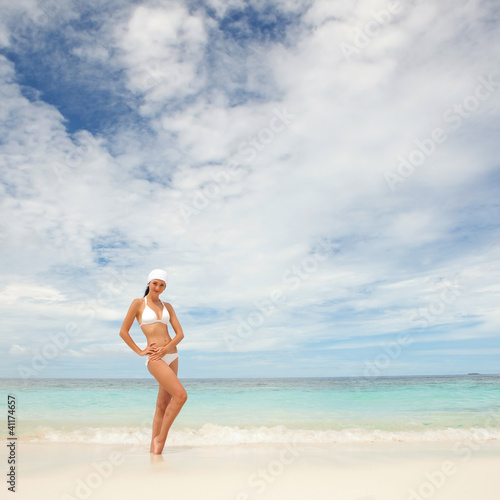 Happy fashion woman on the beach © Dmytro Sunagatov