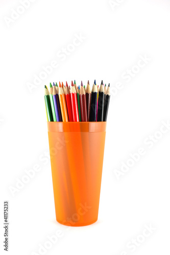 Color pencils in the orange prop over white