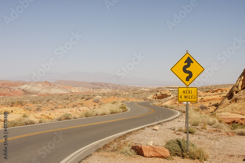 Road Sign for Curves in Desert