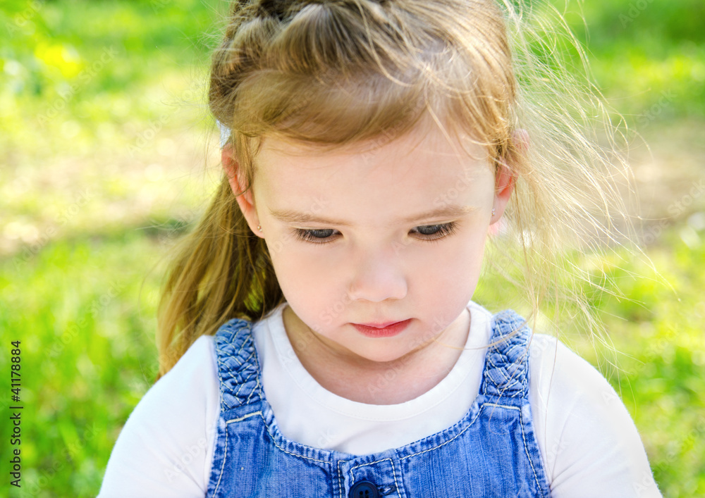 Portrait of little girl looking down Portrait of little girl looking down