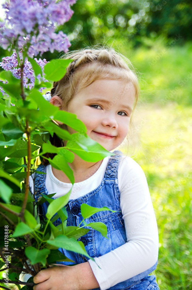 Portrait of smiling cute little girl outdoors Portrait of smiling cute little girl outdoors