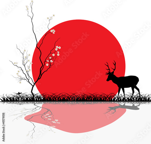 deer near blossomed cherry tree at sunset
