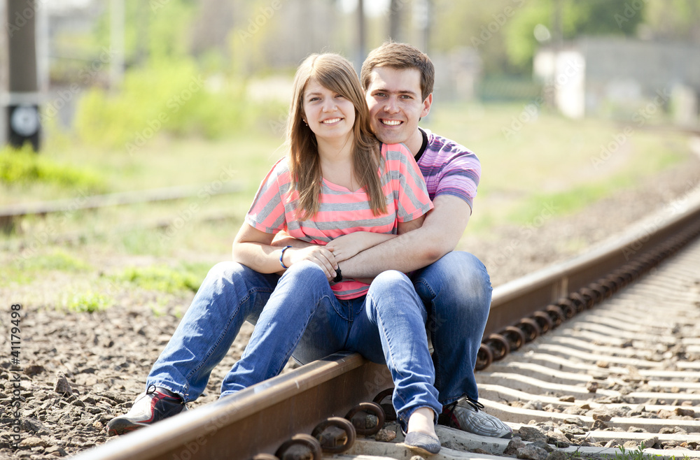 Fototapeta premium Couple sitting at railway.