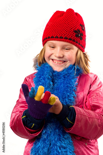 Pretty little girl dressed winter clothes isolated on white back