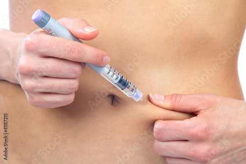 Diabetes dependent female doing human insulin shot