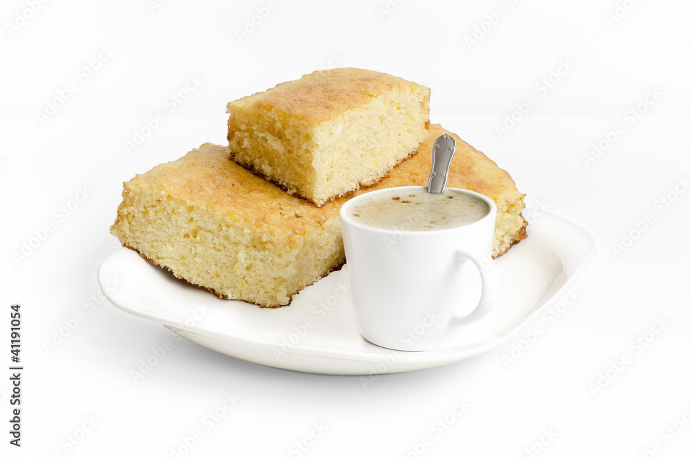 Sponge cake and a cup of coffe on white background Sponge cake and a cup of coffe on white background