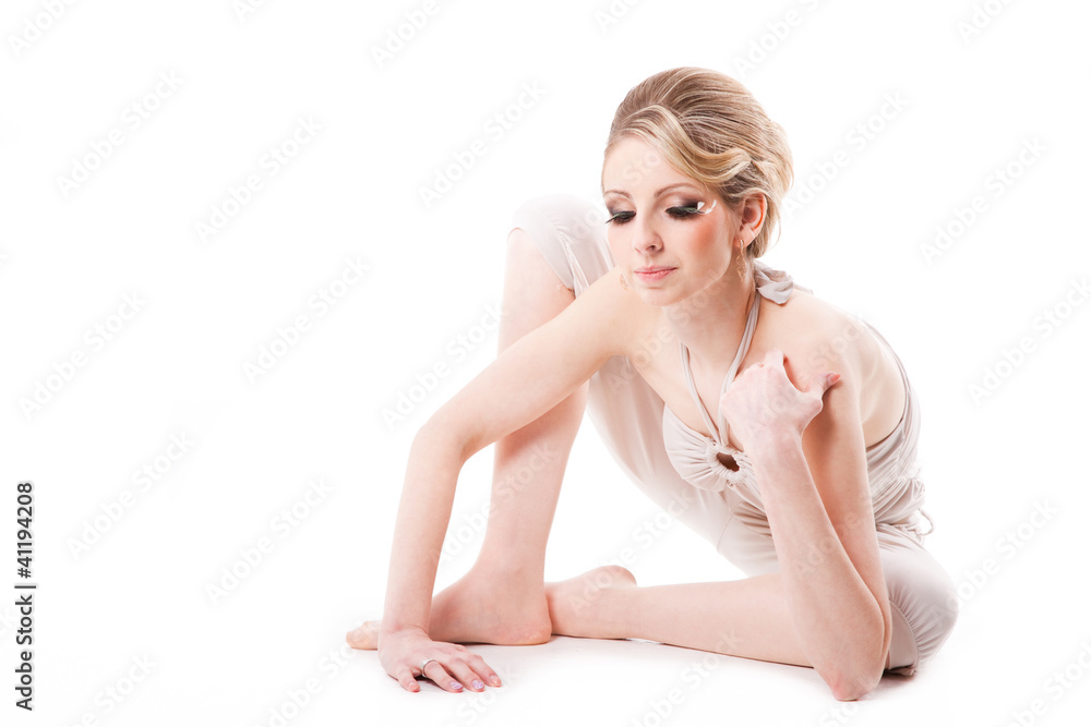 Fototapeta premium beautiful fashionable blonde woman sitting isolated on white