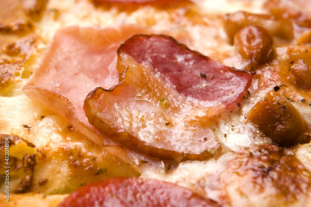 Italian pizza with bacon, salami and mozzarella cheese Italian pizza with bacon, salami and mozzarella cheese