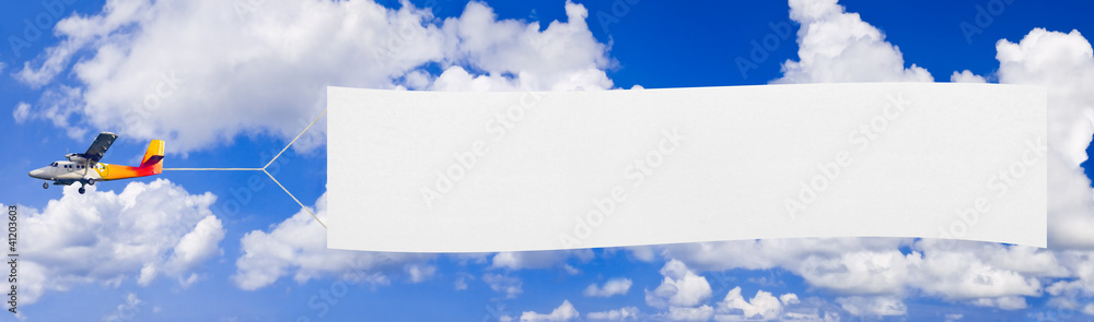 Flying airplane and banner