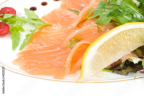 salmon with lemon on white photo