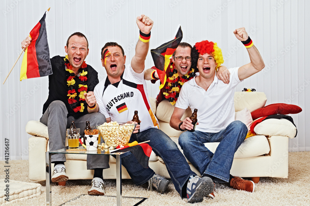 Naklejka premium german soccer fans on the sofa