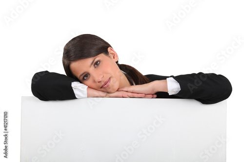woman leaning on a board photo