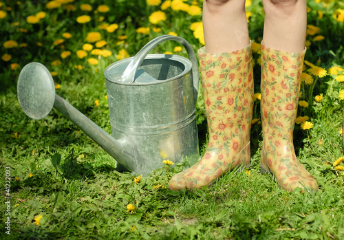 Waterpot and rubber boots photo