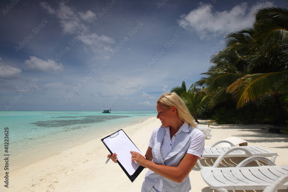 business woman with blank paper on the ocean coast