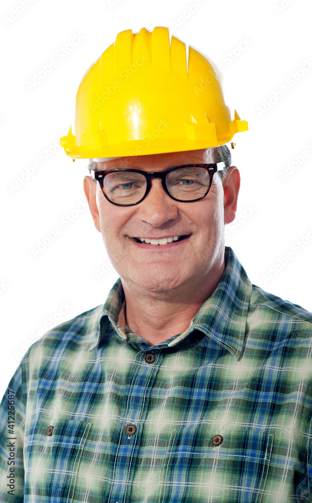 Closeup of senior architect in hardhat, smiling Closeup of senior architect in hardhat, smiling