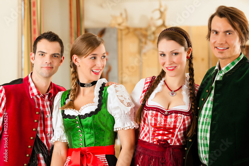 Junge Leute in Bayerischer Tracht in Restaurant photo