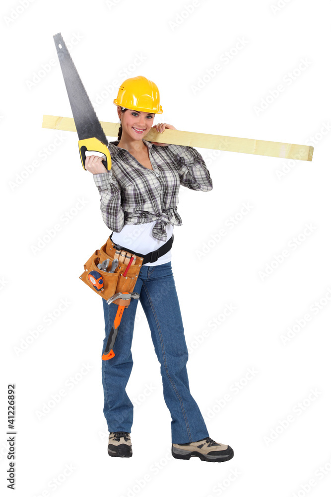 Woman carrying a handsaw and timber
