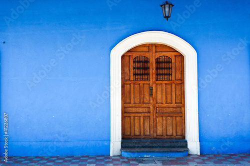 Wallpaper Mural Wooden door and blue wall