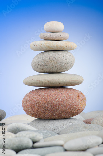 Pebbles stack against gradient background