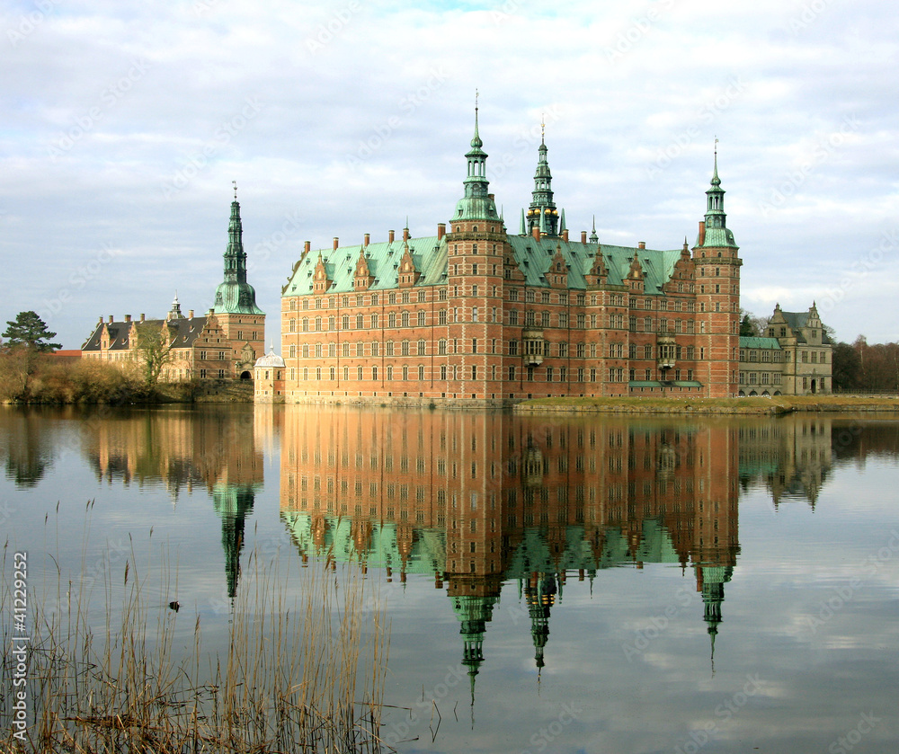 View of Frederiksborg Castle in Hillerod, Denmark. Beautiful reflection of the castle in the water of Palace Lake, in the morning. Now the Museum, it was opened to the public in 1882. View of Frederiksborg Castle in Hillerod, Denmark. Beautiful reflection of the castle in the water of Palace Lake, in the morning. Now the Museum, it was opened to the public in 1882.