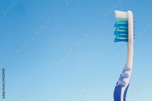 toothbrush on blue background