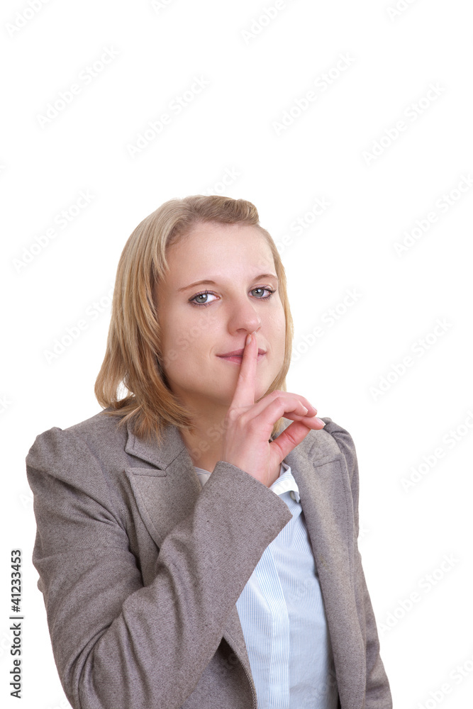 Redeverbot - Junge Frau hält sich den Zeigefinger an die Lippen Redeverbot - Junge Frau hält sich den Zeigefinger an die Lippen