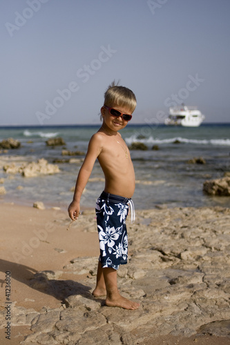 A fair-haired child on the seashore