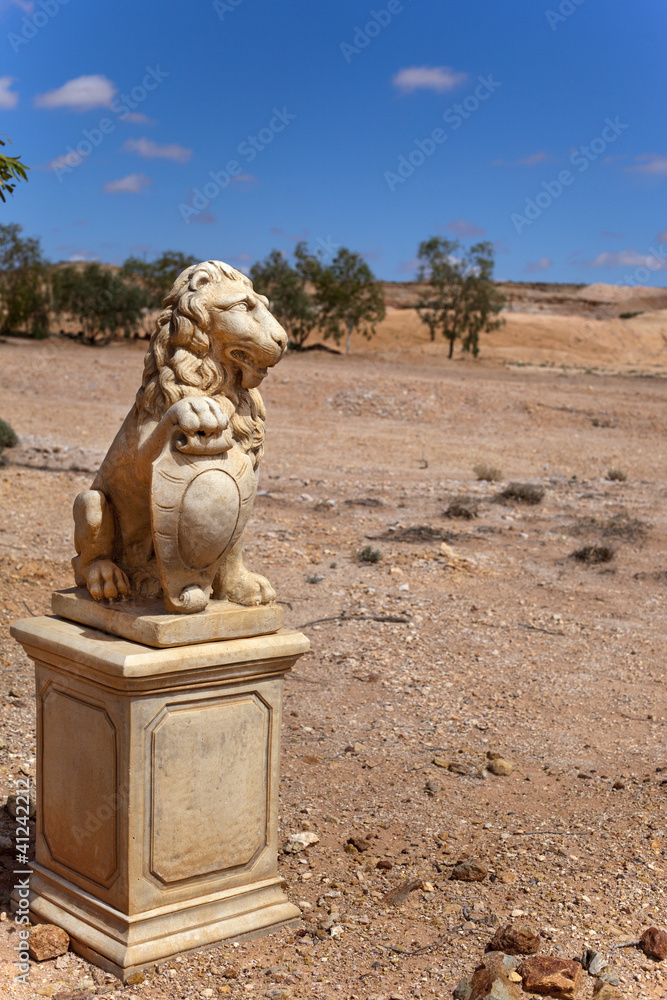 stone lion in desert