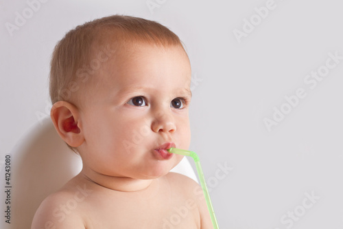 portrait of a baby boy, drinking