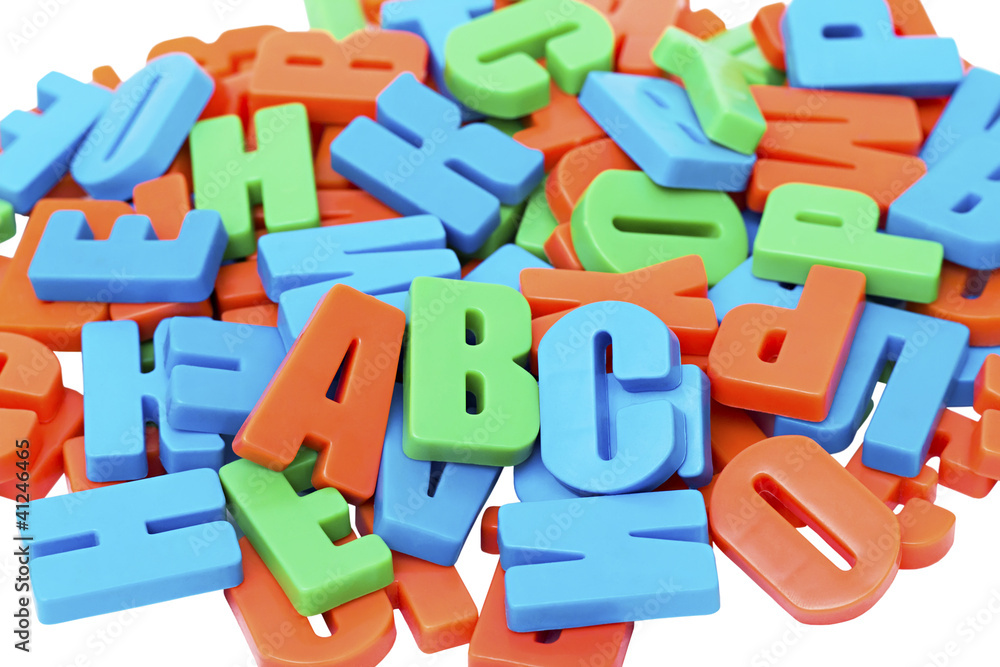 Naklejka premium Colorful alphabet letters on a magnet