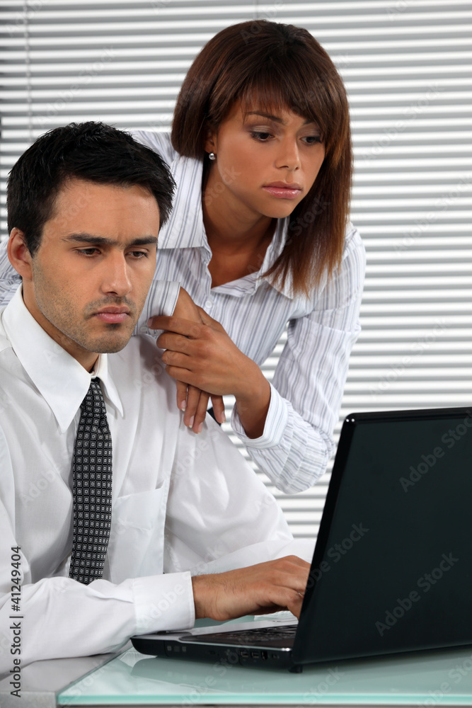 Business couple with strong work ethic Business couple with strong work ethic